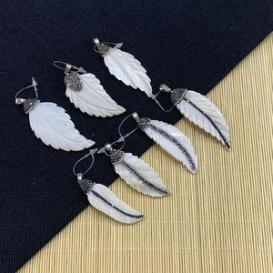 Natural white shell feather pendants with leaf carvings and micro-set rhinestones