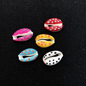 Detailed close-up of colorful hand-painted natural seashells for DIY jewelry making