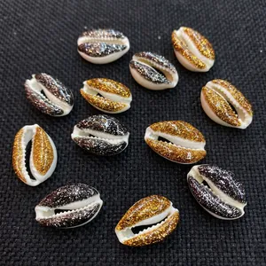 Macro detail of decorative gold and silver glitter seashells for DIY jewelry making