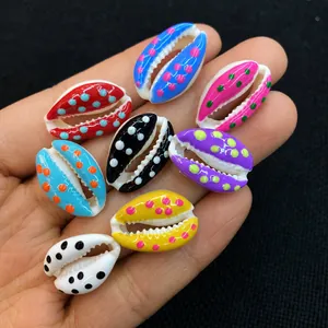 Close-up of colorful polka dot seashells for DIY jewelry making in eight vibrant colors