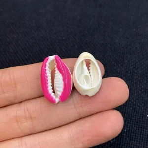 Close-up of natural shell charms in white and rose red for DIY jewelry making