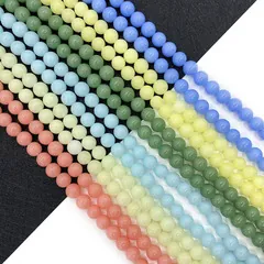 Close-up of polished 6mm to 10mm round natural stone beads in assorted pastel colors