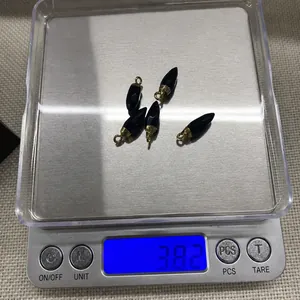 Weight measurement of 5pcs blue sandstone bullet charms with golden metal loops