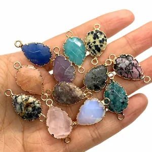 Detailed close-up of faceted teardrop natural stone connectors for DIY jewelry making