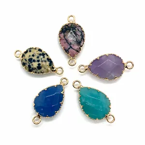 Macro detail of faceted gemstone teardrop connectors in five colors for DIY jewelry making