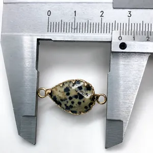 Detail view of Dalmatian Jasper teardrop connector with gold trim and size measurement