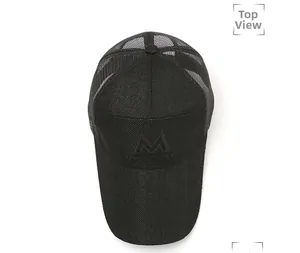 Top view of a black baseball cap featuring mesh panels and letter M embroidery