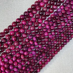 Polished deep pink tiger eye beads in various sizes for DIY jewelry making