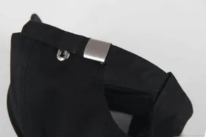 Detail of adjustable metal buckle and black twill fabric on the back of the baseball cap