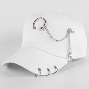 White baseball cap with silver metal rings, chains and a number five pendant