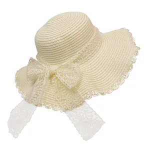 Elegant wide-brim straw sun hat for women with wavy lace edges and large white bow
