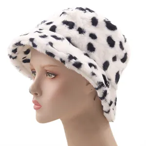 Winter faux mink fur bucket hat with black spotted pattern on white plush material