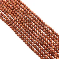Vue détaillée de perles de grès brun facettées de 6mm pour la création de bijoux DIY