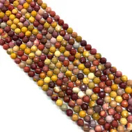 Vue macro de perles rondes en Jaspe Mookaite facetté 6mm pour la création de bijoux