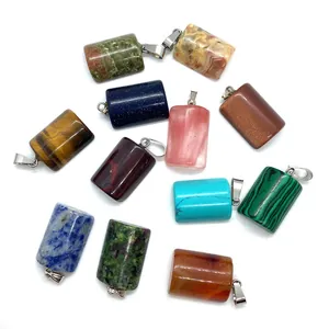 Natural stone semi-cylinder pendants in 12 colors with silver clasps on white background