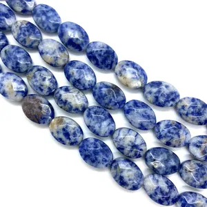 Macro shot of oval sodalite beads showing unique blue and white mineral textures