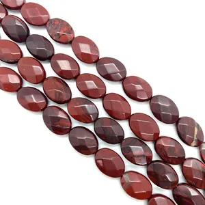 Macro view of faceted oval red jasper beads showing natural stone textures and patterns