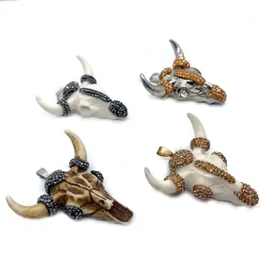 Acrylic bull skull pendants with rhinestones in black, gold, and white finishes