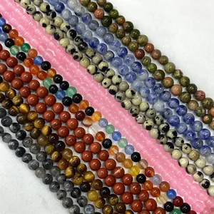 Assortimento di perle in pietra naturale tra cui quarzo per creazione di gioielli