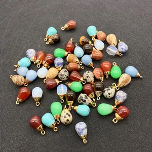 Macro view of teardrop natural stone pendants with gold plated clasps for DIY jewelry
