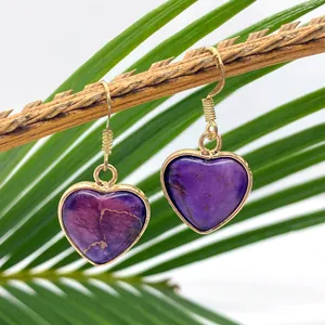 Natural purple heart-shaped stone drop earrings with gold metal hooks on branch