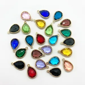 Macro detail of faceted teardrop crystal charms in various colors for DIY jewelry making