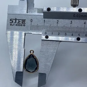 Macro view of teardrop faceted gemstone pendant measured with a caliper for DIY jewelry