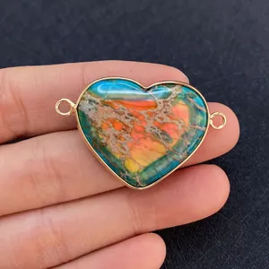 Macro detail of heart-shaped stone connector with gold plating for jewelry DIY