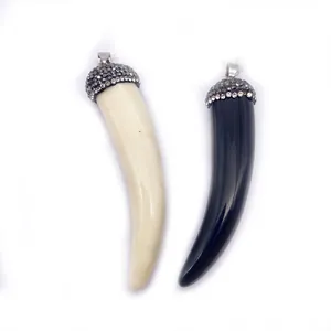 Ethnic style chili shape bone pendants in black and cream white with rhinestone caps