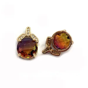 Detail of faceted gradient crystal pendant with golden crown and zircon embellishment