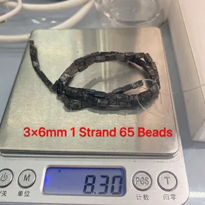 Gedetailleerd beeld van 3x6mm grijze natuursteen kralen van 8,30g voor DIY-sieraden