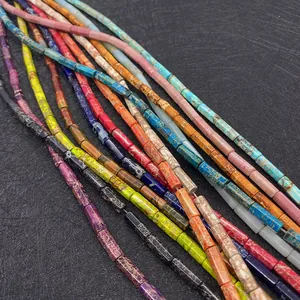 Macro shot of colorful imperial stone tube beads with natural marble texture patterns