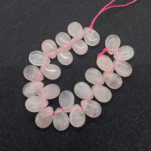 Macro shot of 10x13mm teardrop rose quartz beads for DIY jewelry making