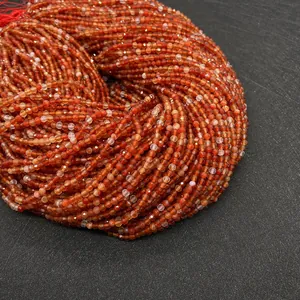 Macro shot of 2-4mm faceted natural red agate round beads for DIY jewelry making