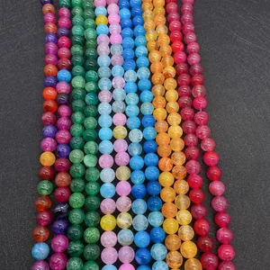 Macro shot of colorful dragon vein agate beads for jewelry making on black background
