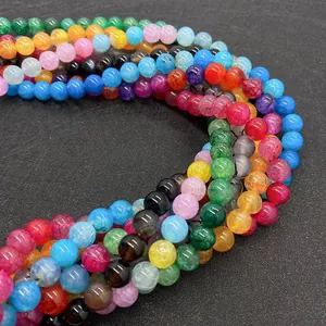 Macro shot of colorful dragon vein agate beads with cracked texture for jewelry making