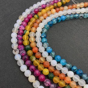 Dettaglio di perle tonde in agata venata di drago da 8mm in vari colori vivaci
