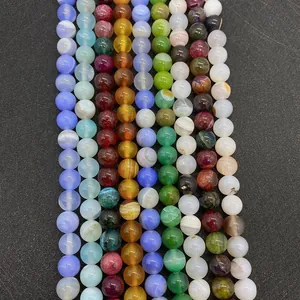 Vertical rows of polished natural silk agate and colorful gemstone beads for DIY necklaces