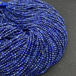 Detailed view of faceted natural lapis lazuli round loose beads for DIY jewelry making