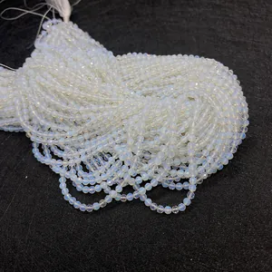 Detailed view of faceted opalite beads showing translucent texture and multi-face cutting