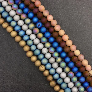 Macro shot of 6-10mm matte natural agate beads with various electroplated colorful finishes