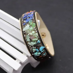 Detail view of Bohemian leather bracelet with colorful natural stones and metal rivets