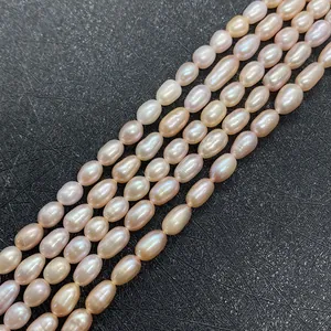 Detail of natural freshwater pearls in pink and white with rainbow luster for jewelry DIY