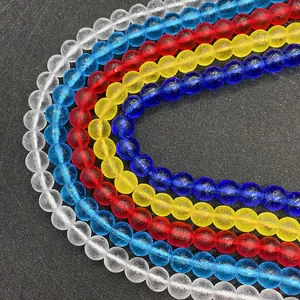 Macro detail of colorful frosted round beads in five colors for DIY jewelry making