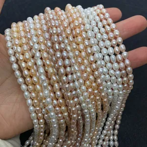 Macro detail of natural freshwater rice pearls in white and pink tones for DIY jewelry