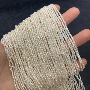 Detailed close-up of 2-3mm irregular rice-shaped white freshwater pearls for jewelry DIY
