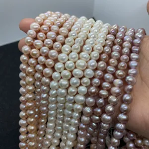 Detail shot of multi-strand natural freshwater pearls in white, pink, and lavender hues