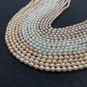 Macro shot of Grade AA white and pink rice-shaped freshwater pearls with natural luster