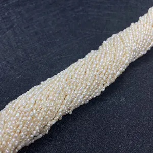 Macro shot of natural Grade A cream white seed pearls 2-3mm for jewelry DIY