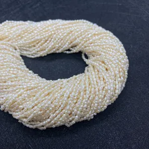 Macro view of loose natural rice pearls in creamy white for DIY jewelry making accessories